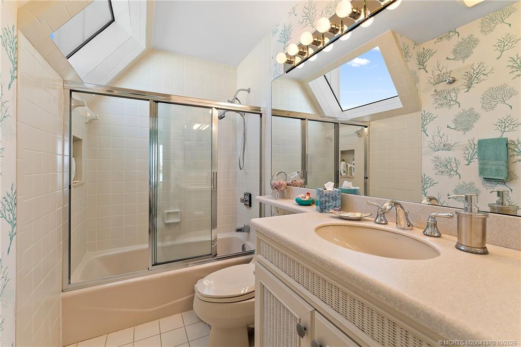 777 Southeast MacArthur Boulevard Stuart, FL 34996 - Photo 30 of 46 a bathroom with a sink a toilet and shower