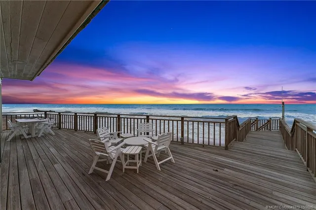 a view of a balcony with chairs