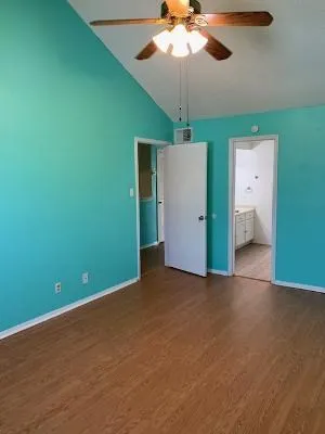 a view of an empty room with a fan