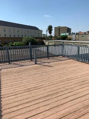 a view of balcony with wooden floor