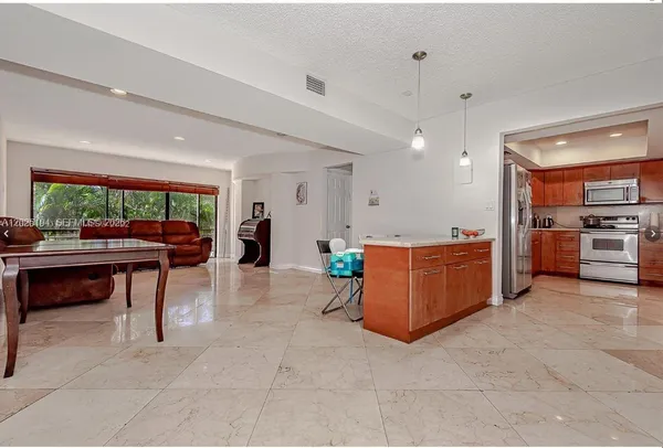 a living room with furniture and a table