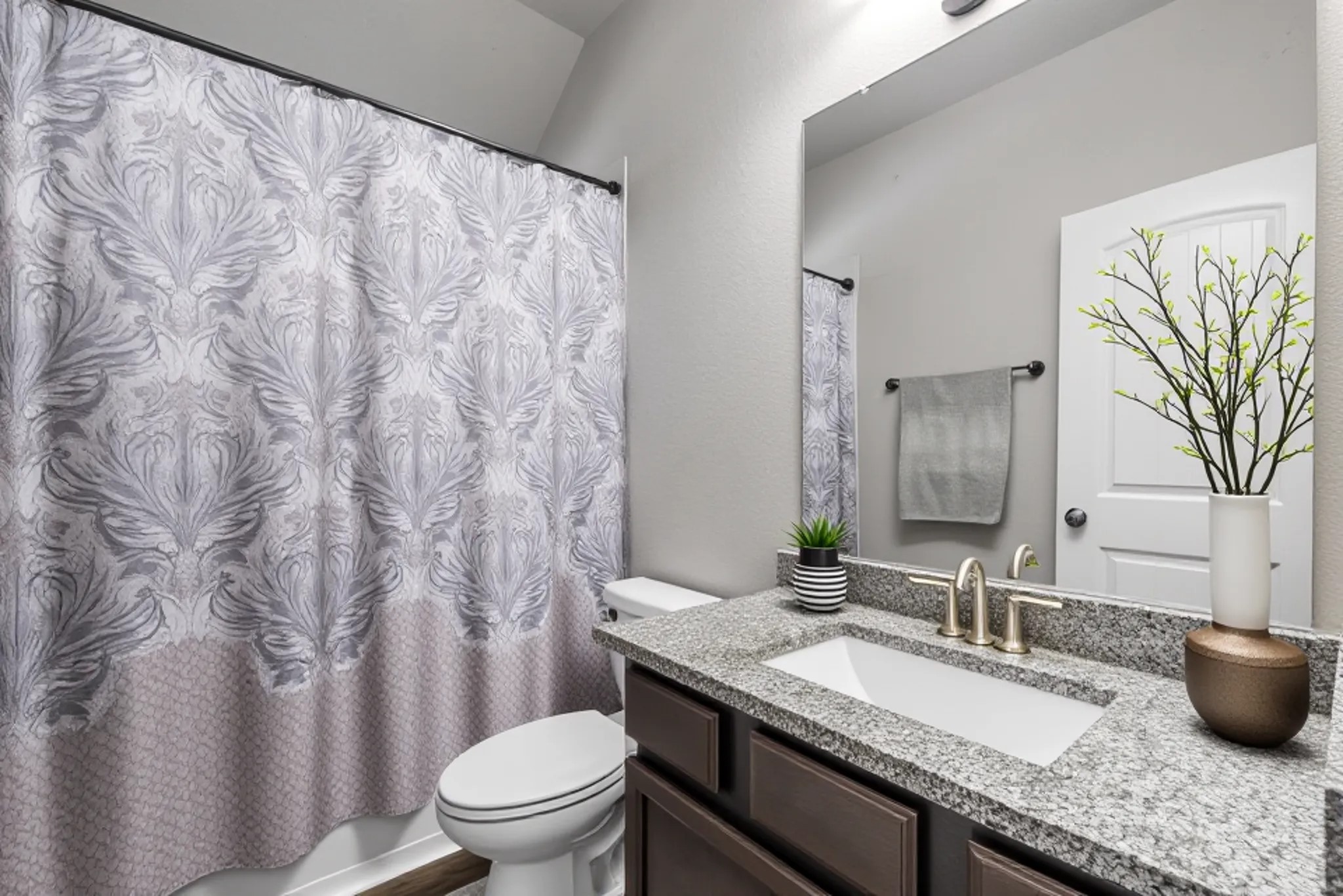 2004 Sadtler Ridge Circle La Porte, TX 77571 - Photo 16 of 23 a bathroom with a granite countertop sink and a mirror