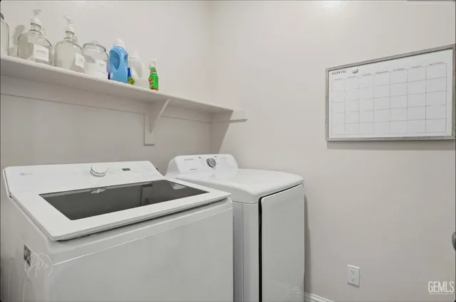 a bedroom with two beds and a window