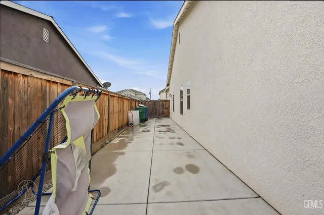 an aerial view of residential houses with yard