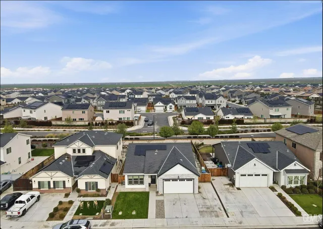 a front view of a house with garage