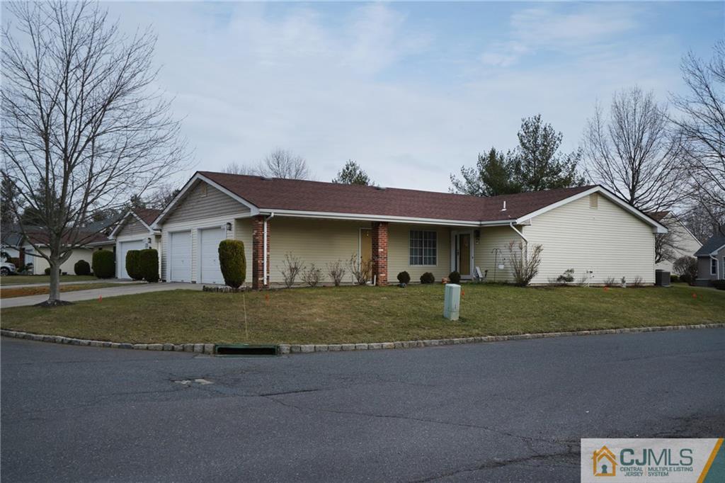 793 Pompton Road, Unit D Monroe Township, NJ 08831 - Photo 2 of 23 a view of a house with a yard and large tree