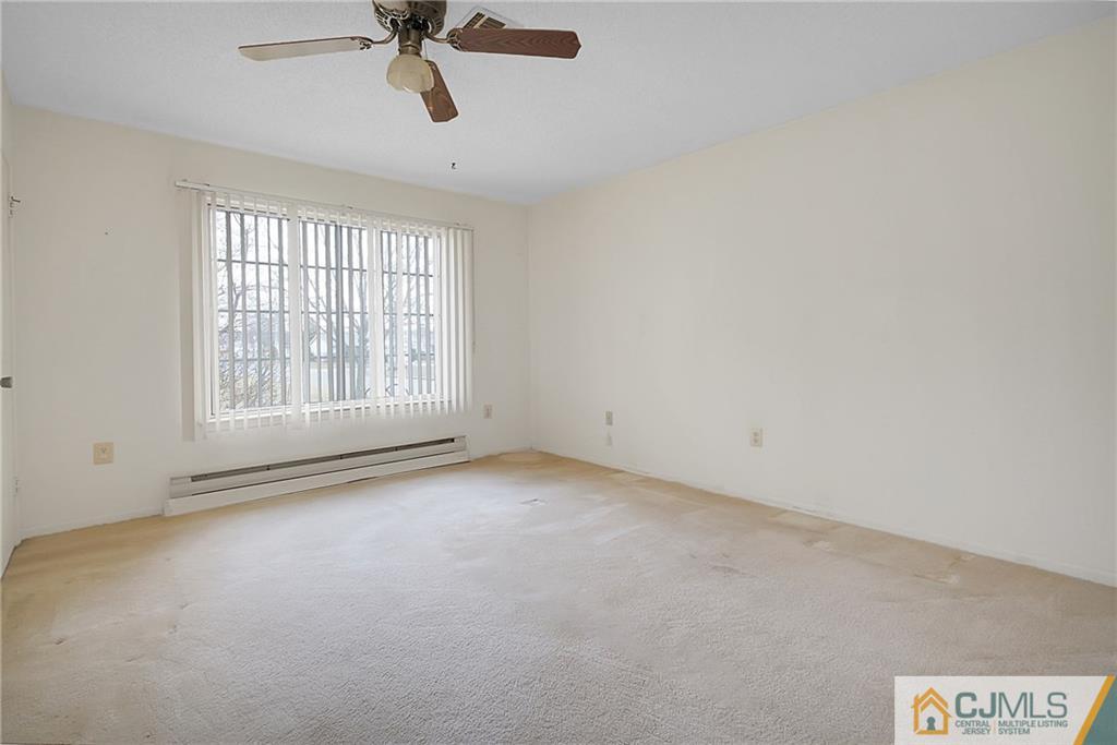 793 Pompton Road, Unit D Monroe Township, NJ 08831 - Photo 12 of 23 an empty room with a window
