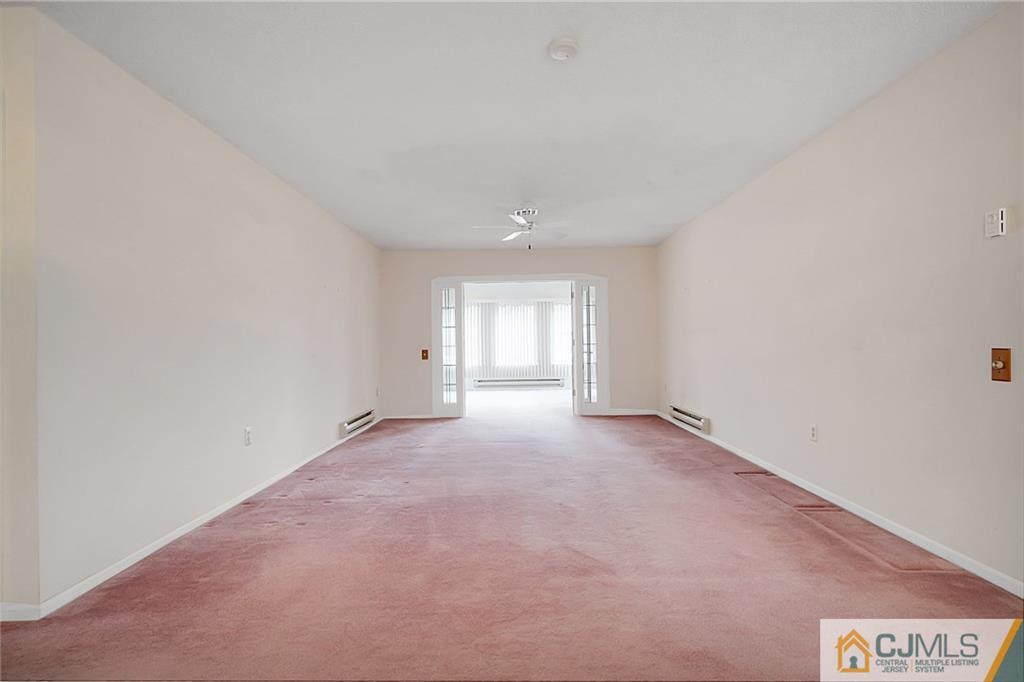 793 Pompton Road, Unit D Monroe Township, NJ 08831 - Photo 13 of 23 a view of an empty room with a window
