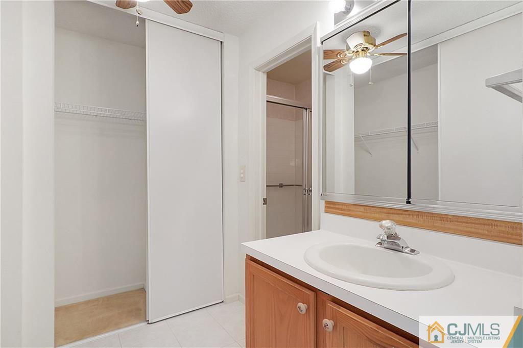 793 Pompton Road, Unit D Monroe Township, NJ 08831 - Photo 14 of 23 a bathroom with a sink and a mirror