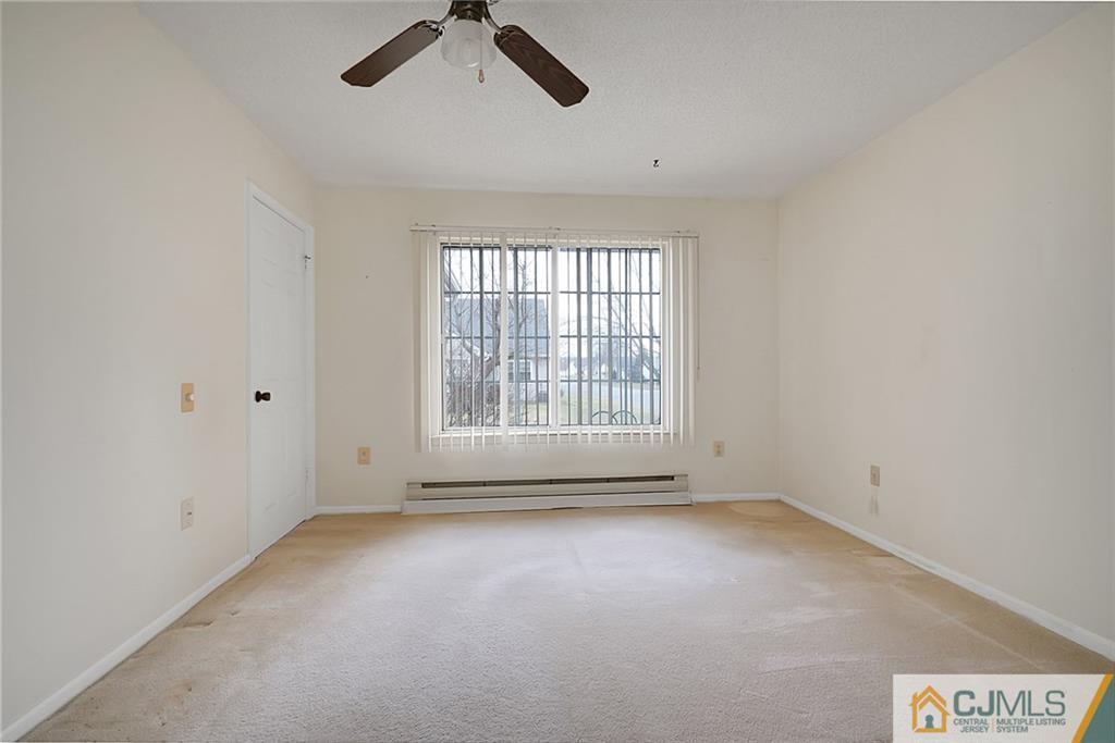 793 Pompton Road, Unit D Monroe Township, NJ 08831 - Photo 15 of 23 an empty room with a empty space and windows