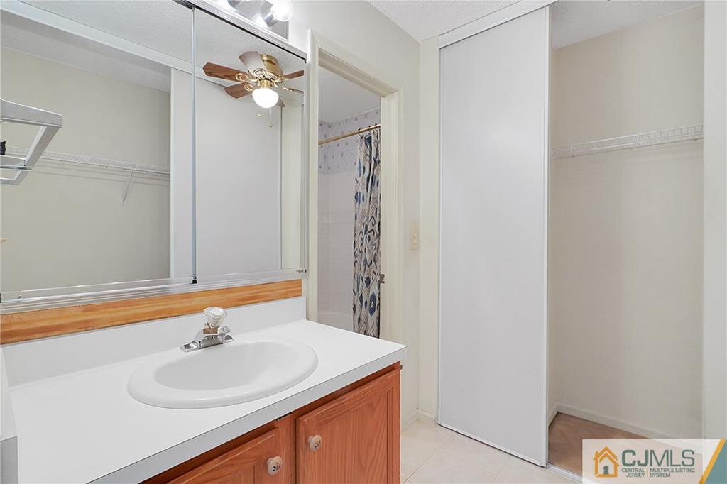 793 Pompton Road, Unit D Monroe Township, NJ 08831 - Photo 16 of 23 a bathroom with a sink and a mirror