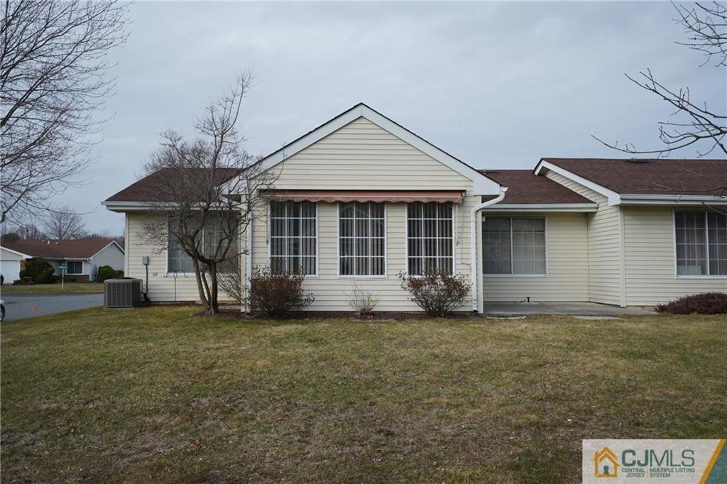 793 Pompton Road, Unit D Monroe Township, NJ 08831 - Photo 19 of 23 a front view of a house with a garden
