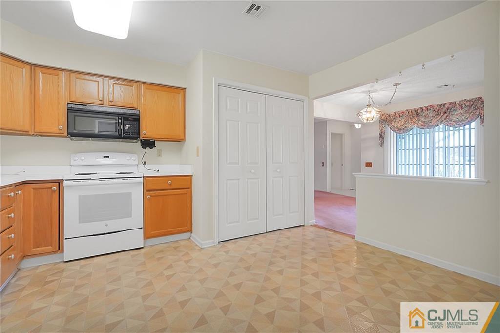 793 Pompton Road, Unit D Monroe Township, NJ 08831 - Photo 10 of 23 a view of a kitchen with microwave and cabinets