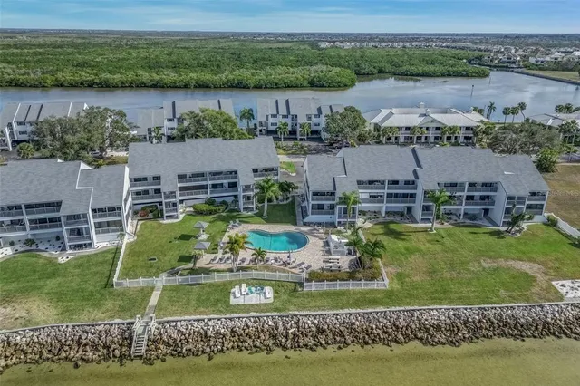 an aerial view of a house with a lake view