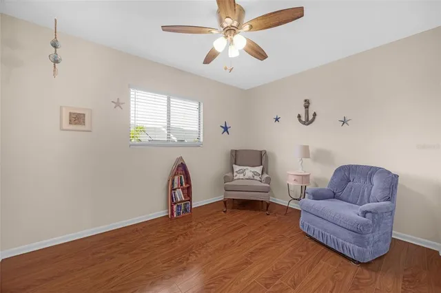 a view of roof deck with a dining table and chairs with wooden floor