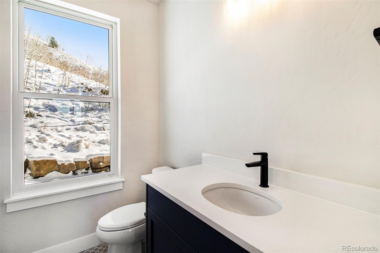 98 High Grove Loop Winter Park, CO 80482 - Photo 15 of 24 a bathroom with a sink a toilet and shower