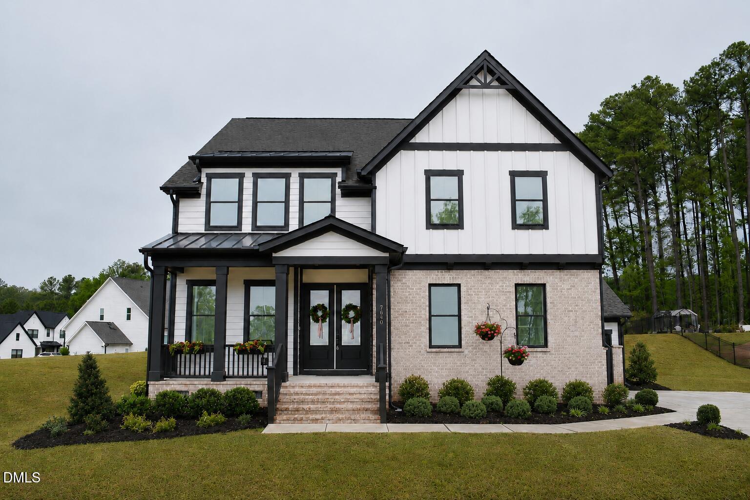 7640 Hasentree Way Wake Forest, NC 27587 - Photo 1 of 40 a front view of a house with a yard