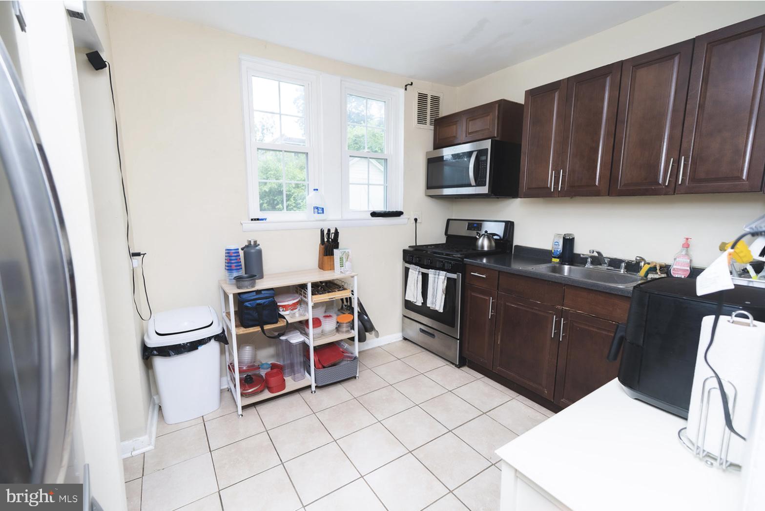 3224 Marshall Road Drexel Hill, PA 19026 - Photo 13 of 24 a view of kitchen with cabinets and wooden floor