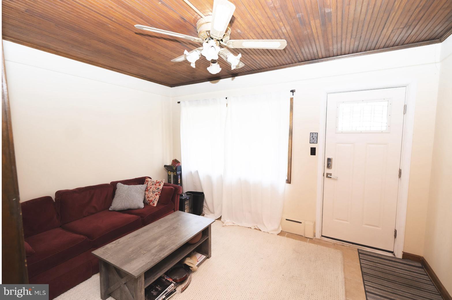 3224 Marshall Road Drexel Hill, PA 19026 - Photo 7 of 24 a living room with furniture and a ceiling fan
