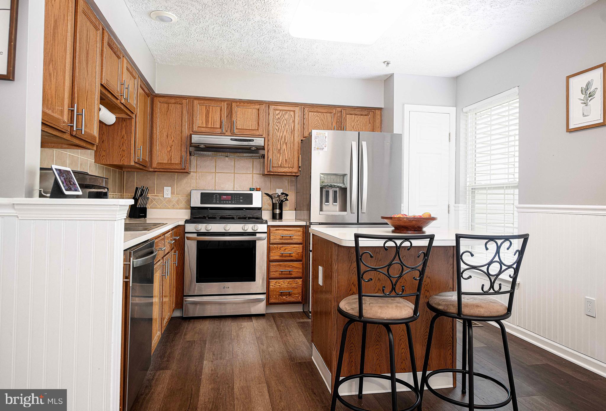 518 MacIntosh Circle Joppa, MD 21085 - Photo 11 of 29 a kitchen with stainless steel appliances a stove a sink dishwasher and a refrigerator