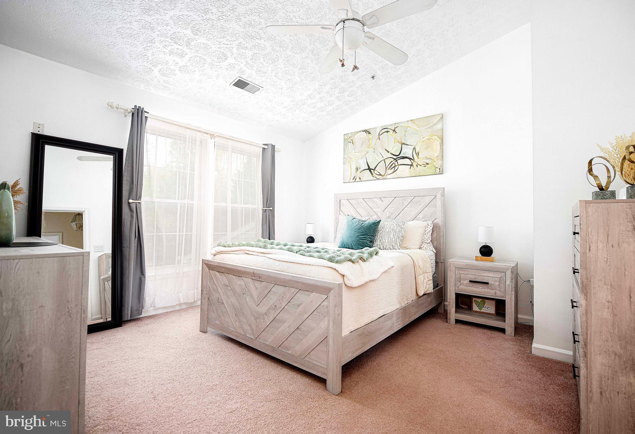 518 MacIntosh Circle Joppa, MD 21085 - Photo 15 of 29 a spacious bedroom with a bed and a window