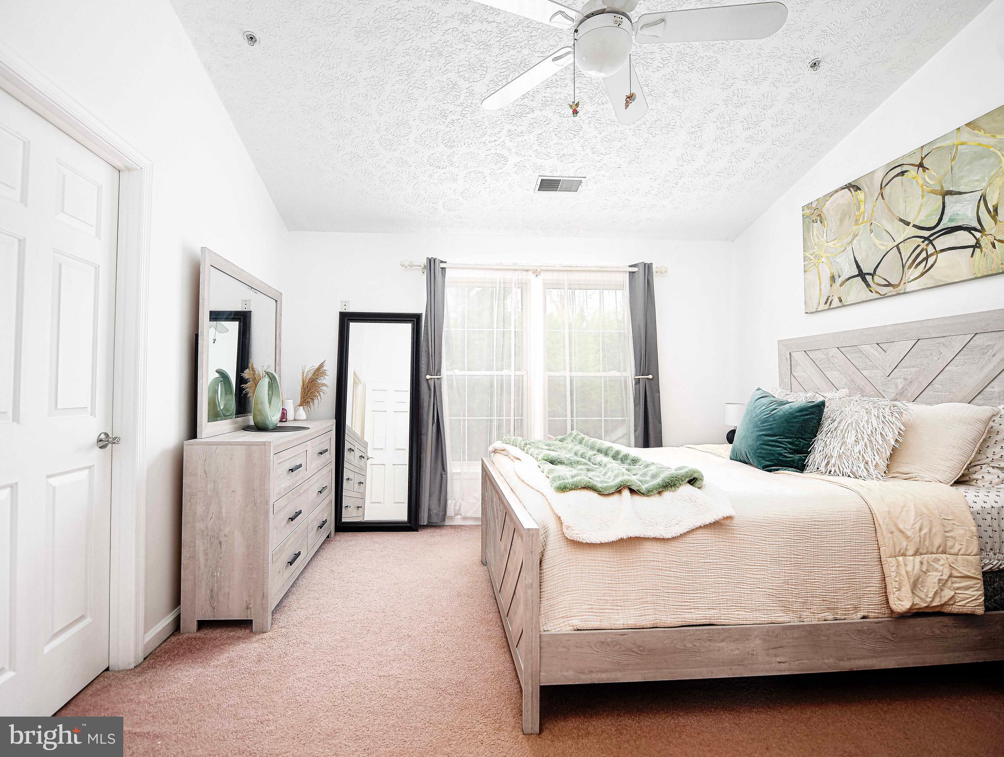 518 MacIntosh Circle Joppa, MD 21085 - Photo 16 of 29 a bedroom with a bed and a dresser