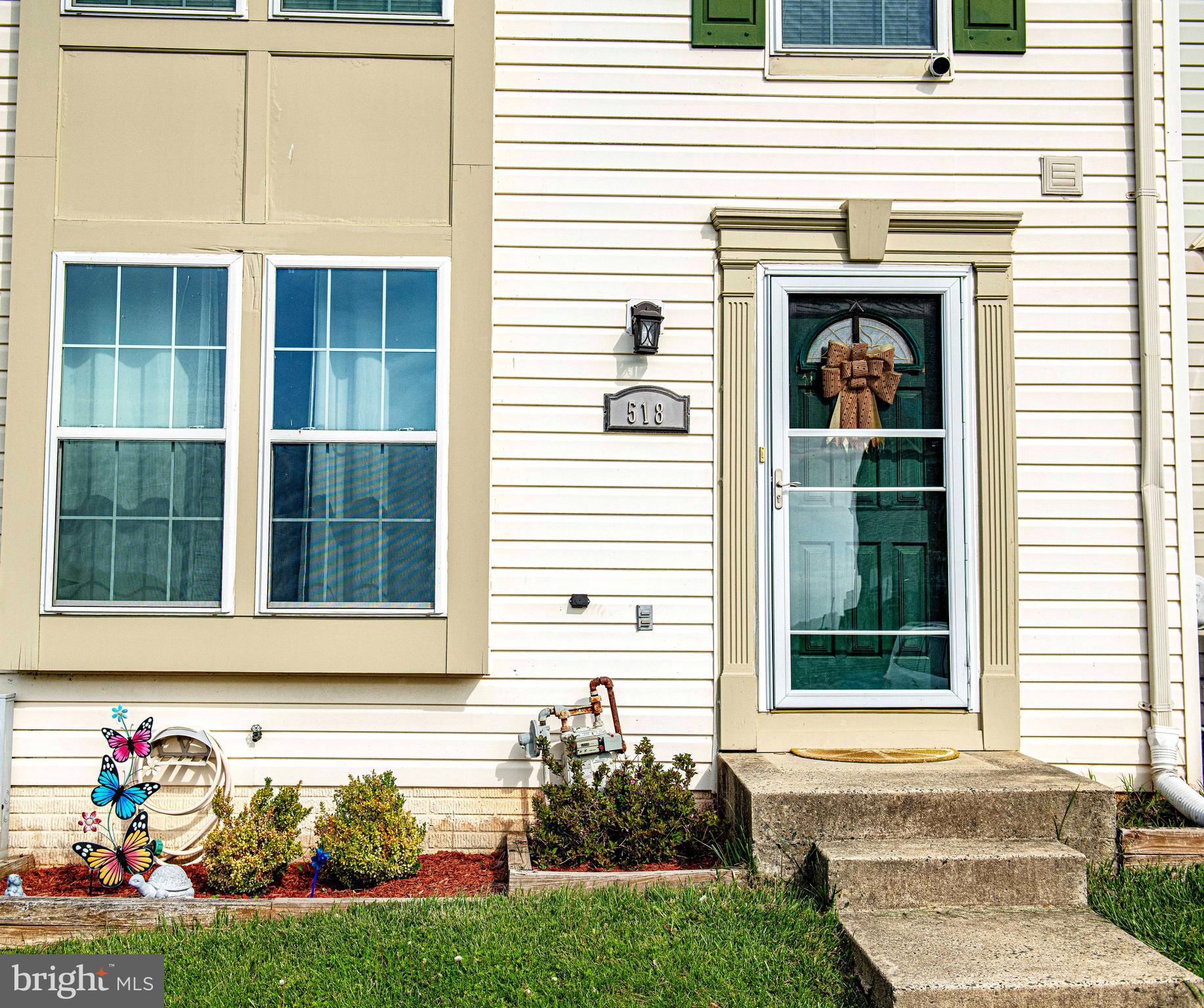 518 MacIntosh Circle Joppa, MD 21085 - Photo 2 of 29 a front view of a house with a yard
