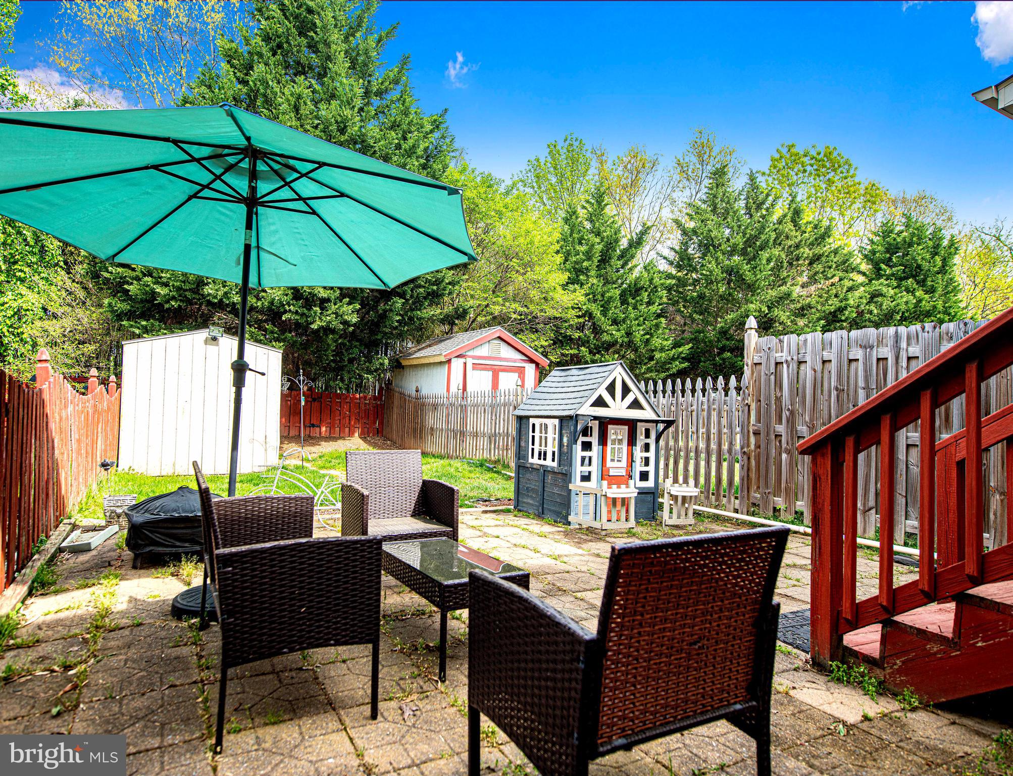 518 MacIntosh Circle Joppa, MD 21085 - Photo 25 of 29 a backyard of a house with table and chairs