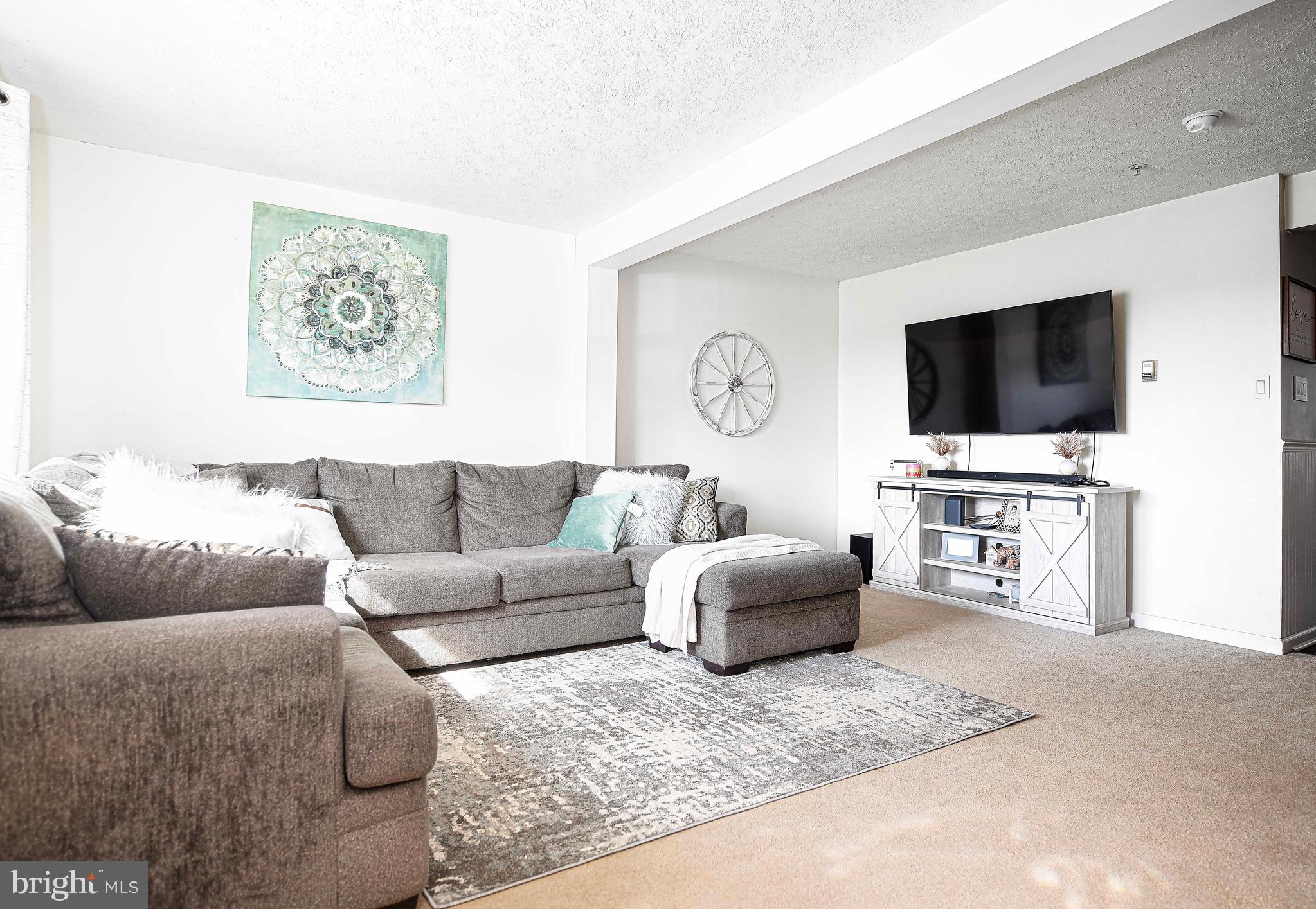 518 MacIntosh Circle Joppa, MD 21085 - Photo 7 of 29 a living room with furniture and a flat screen tv