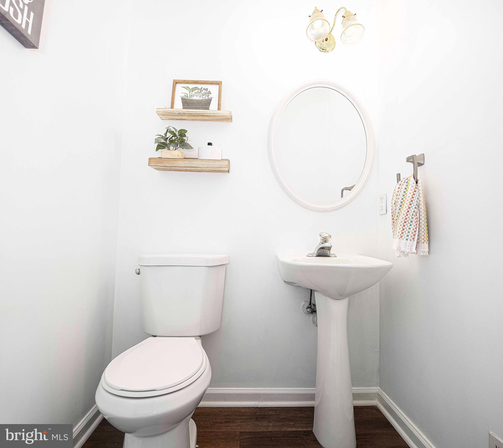 518 MacIntosh Circle Joppa, MD 21085 - Photo 8 of 29 a bathroom with a sink toilet and a mirror