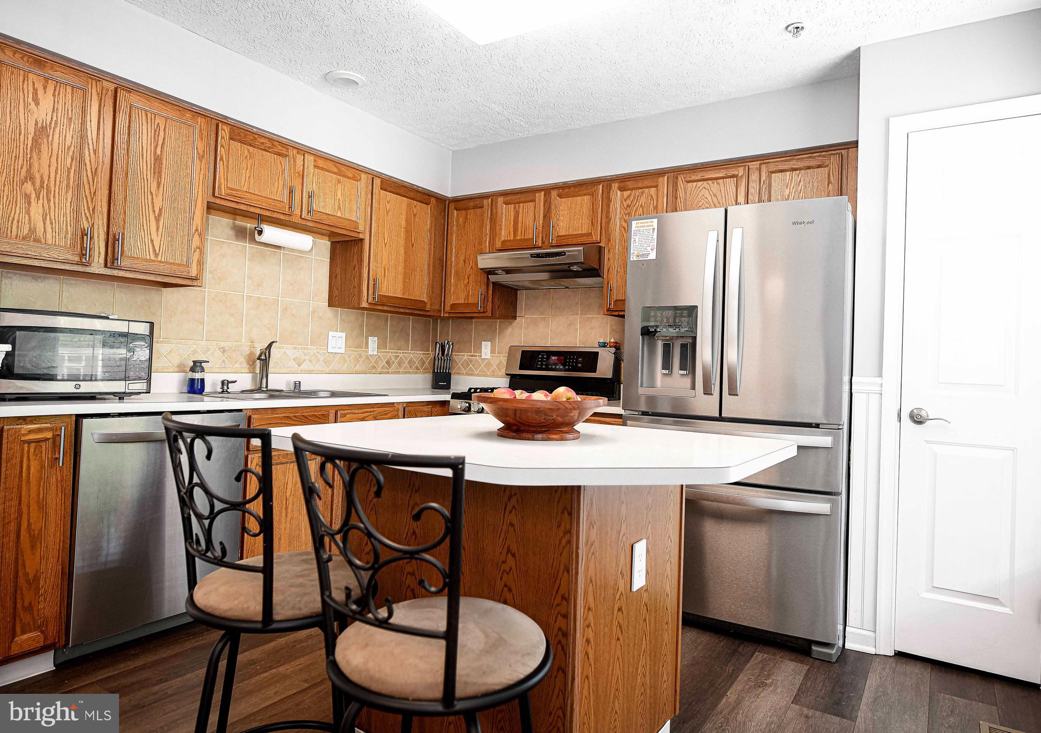 518 MacIntosh Circle Joppa, MD 21085 - Photo 9 of 29 a kitchen with stainless steel appliances granite countertop a sink and cabinets