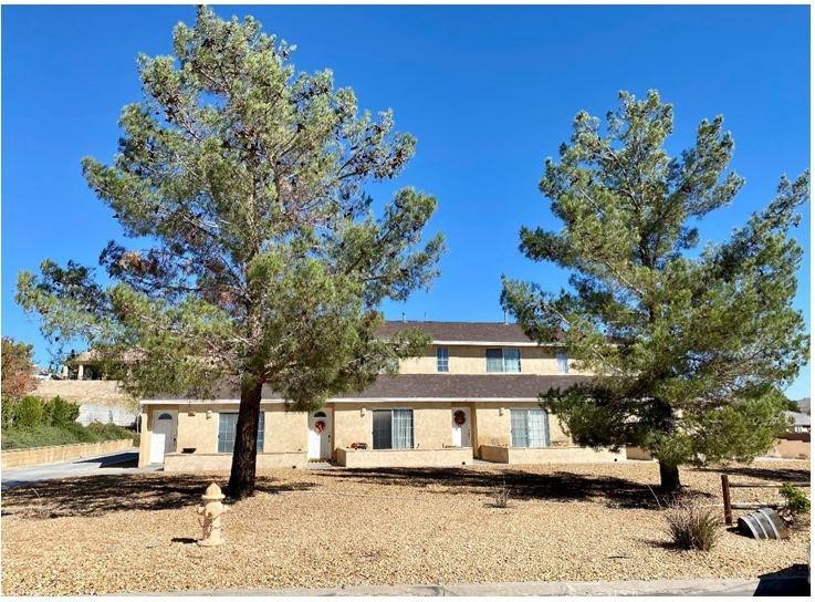 16359 Siskiyou Road Apple Valley, CA 92307 - Photo 1 of 1 a front view of a house with a yard