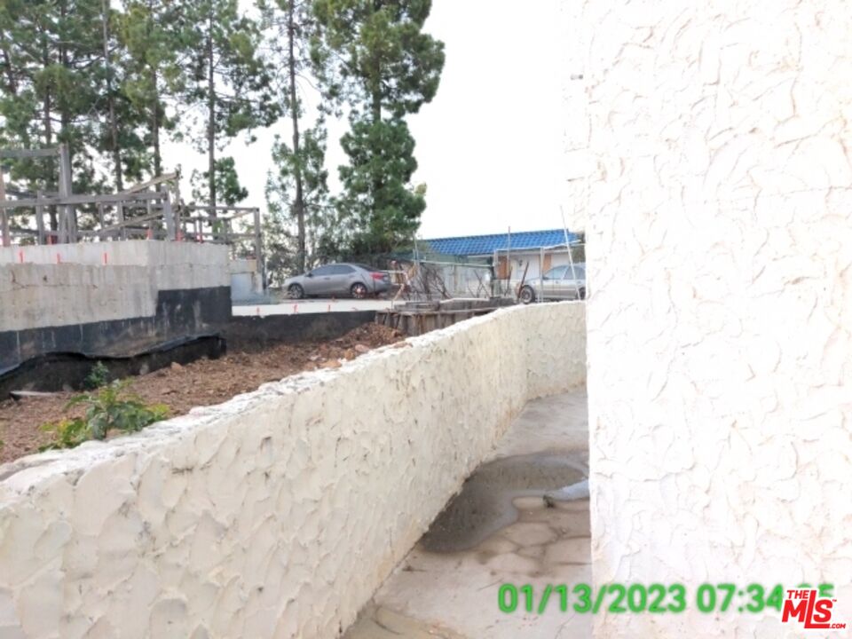 1830 Bel Air Road Los Angeles, CA 90077 - Photo 10 of 12 a view of a backyard with wooden fence