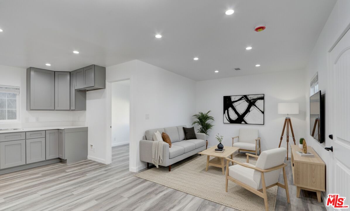 507 Sinaloa Avenue Pasadena, CA 91106 - Photo 3 of 11 a living room with furniture and a flat screen tv