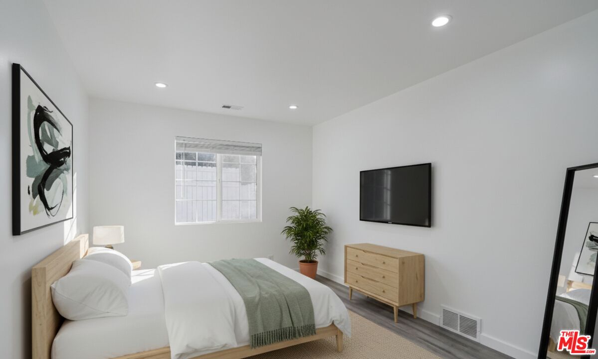 507 Sinaloa Avenue Pasadena, CA 91106 - Photo 5 of 11 a bedroom with a bed tv and window