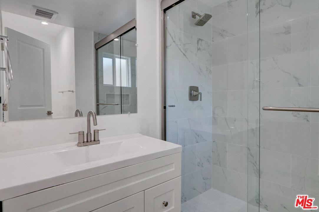 507 Sinaloa Avenue Pasadena, CA 91106 - Photo 6 of 11 a bathroom with a sink and a mirror