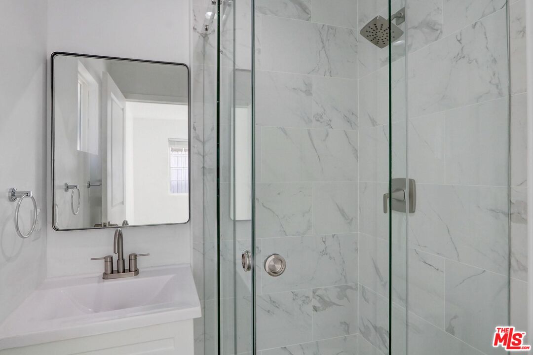 507 Sinaloa Avenue Pasadena, CA 91106 - Photo 9 of 11 a bathroom with a shower and a sink