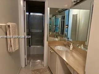 a bathroom with a sink and mirror