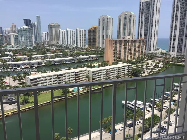 a balcony with table and chairs