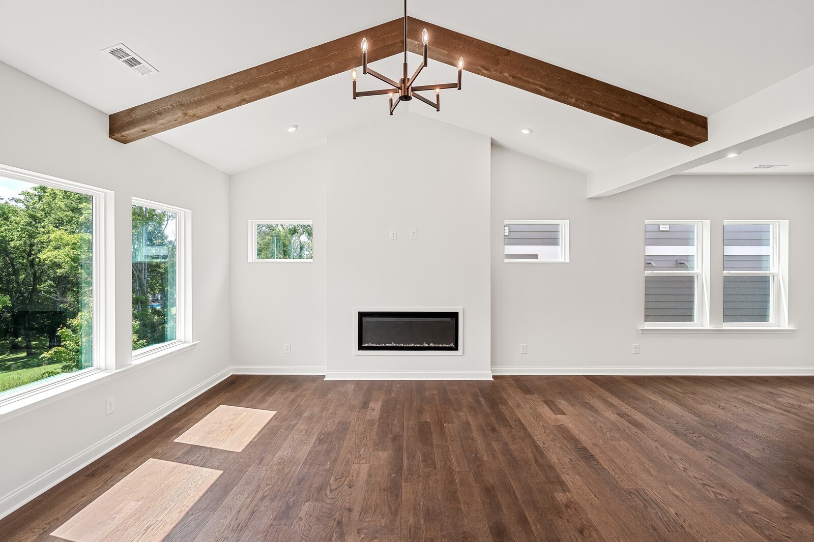 1040 Cherry Tree Drive Mount Juliet, TN 37122 - Photo 12 of 47 a view of a big room with wooden floor and a ceiling fan