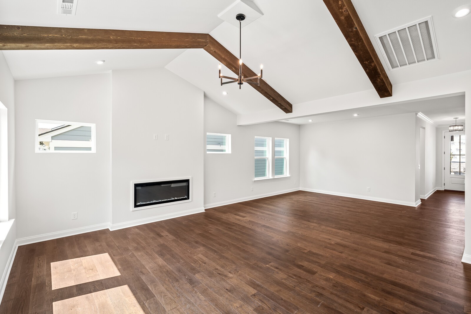 1040 Cherry Tree Drive Mount Juliet, TN 37122 - Photo 13 of 47 a view of an empty room with wooden floor and a window