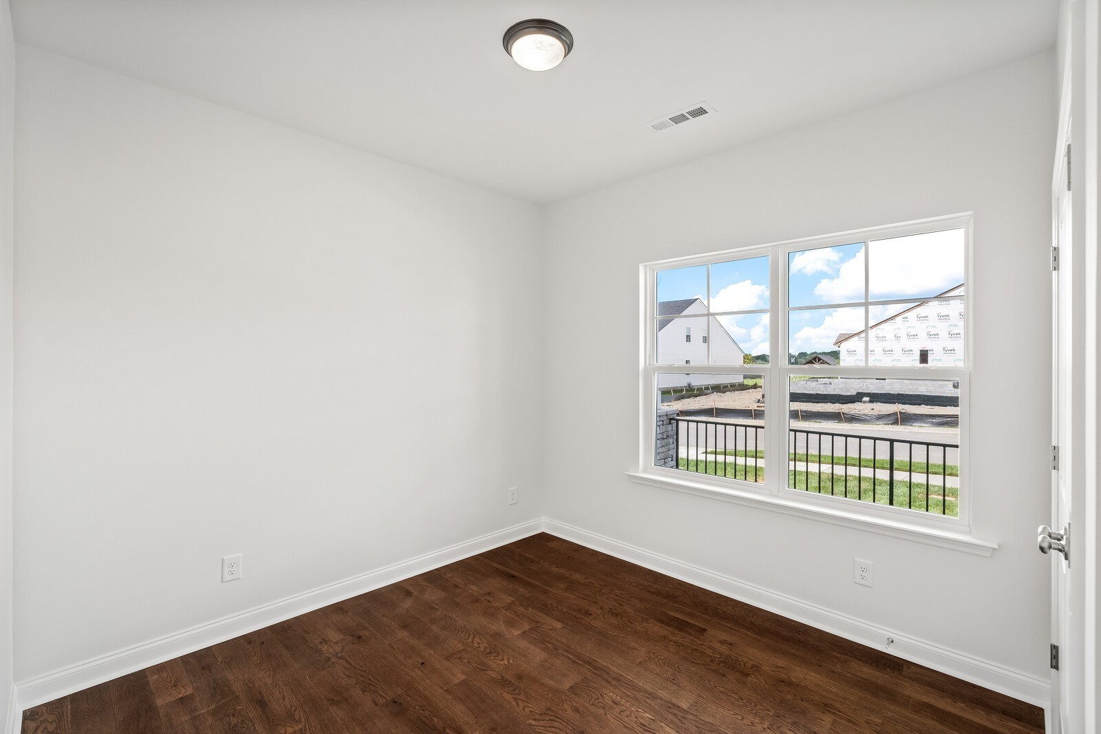 1040 Cherry Tree Drive Mount Juliet, TN 37122 - Photo 32 of 47 an empty room with wooden floor and windows