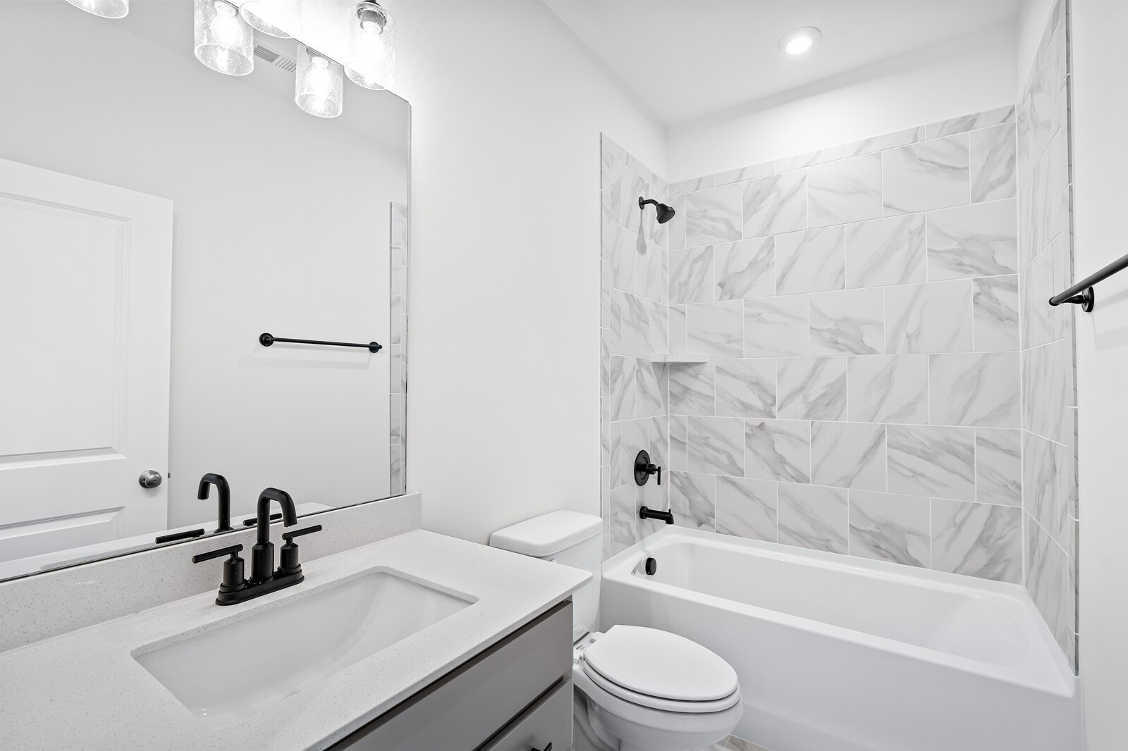 1040 Cherry Tree Drive Mount Juliet, TN 37122 - Photo 33 of 47 a bathroom with a sink a toilet a mirror a bathtub and shower