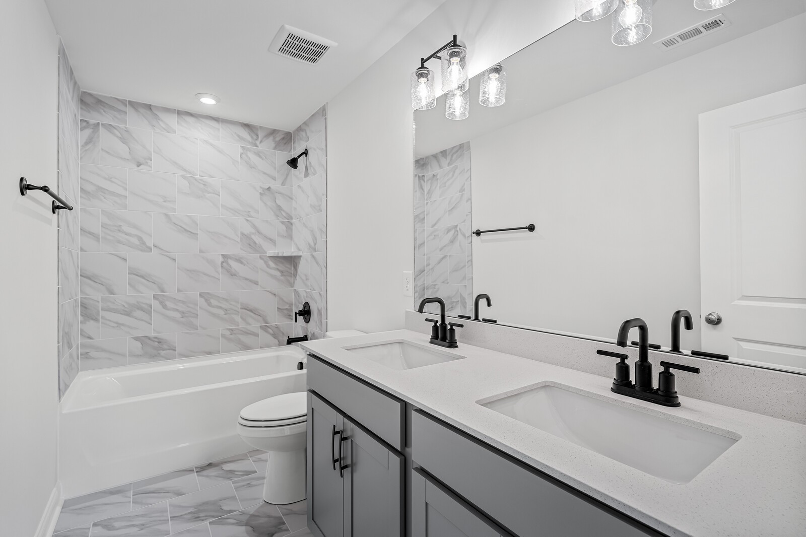 1040 Cherry Tree Drive Mount Juliet, TN 37122 - Photo 36 of 47 a bathroom with a sink a toilet and a tub