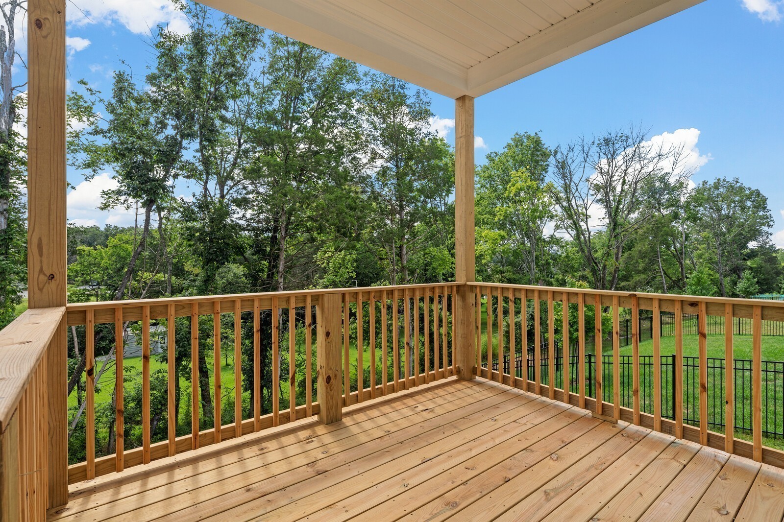 1040 Cherry Tree Drive Mount Juliet, TN 37122 - Photo 40 of 47 a balcony with wooden floor and fence