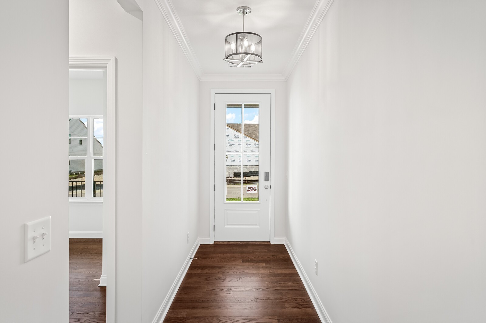 1040 Cherry Tree Drive Mount Juliet, TN 37122 - Photo 6 of 47 a view of a hallway with wooden floor and a dining room