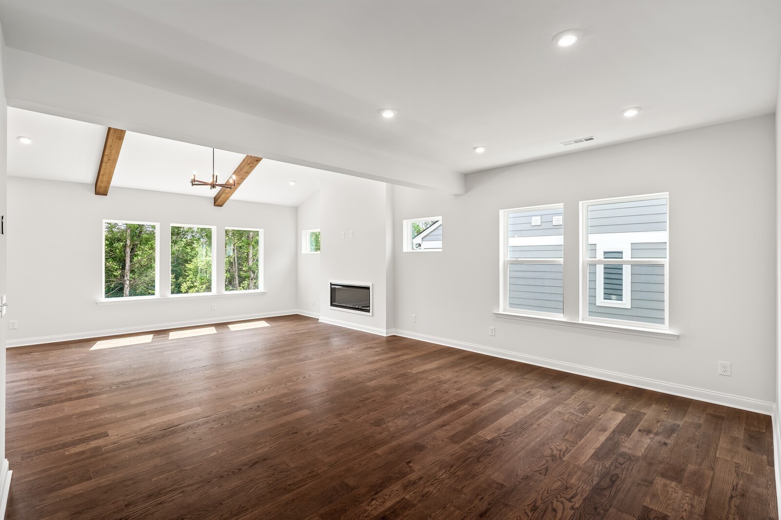 1040 Cherry Tree Drive Mount Juliet, TN 37122 - Photo 7 of 47 a view of an empty room with wooden floor and a window