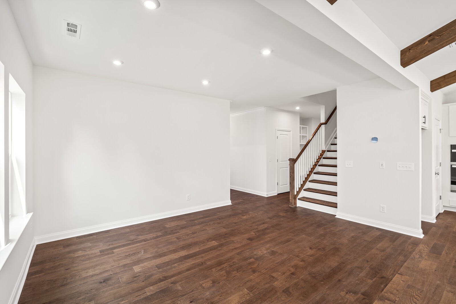 1040 Cherry Tree Drive Mount Juliet, TN 37122 - Photo 8 of 47 wooden floor in an empty room with stairs