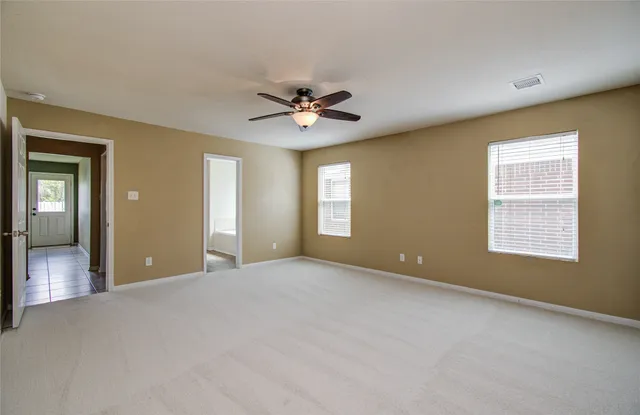 a view of an empty room with a window