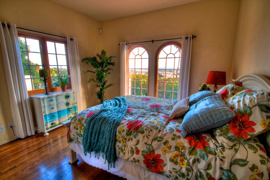 1010 Garcia Road Santa Barbara, CA 93103 - Photo 12 of 20 a bed sitting in a bedroom next to a window